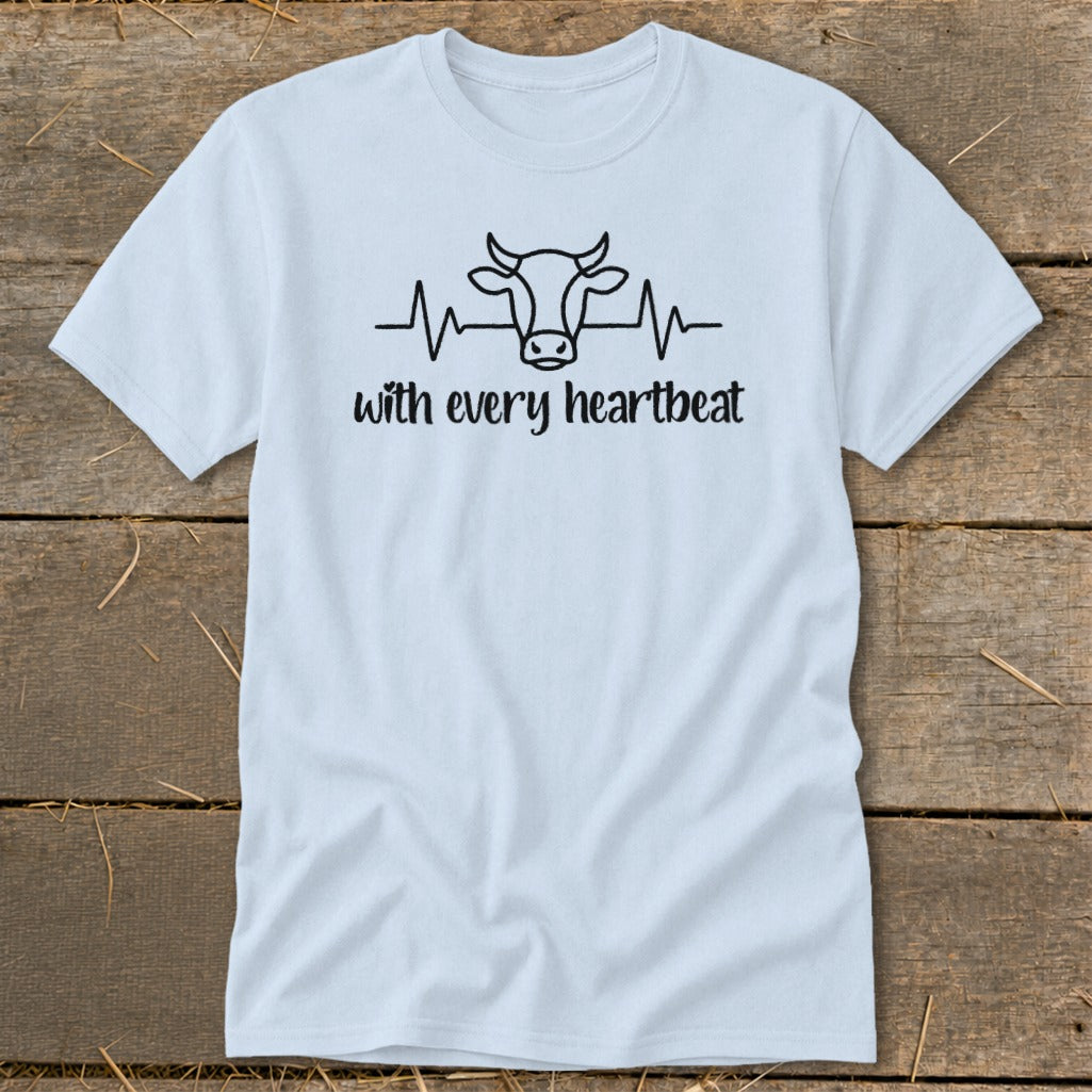 Light blue t-shirt with cow head and heartbeat graphic and text