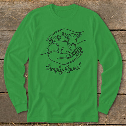 Green long-sleeved shirt with line art of hands holding a lamb and "Simply Loved" text.