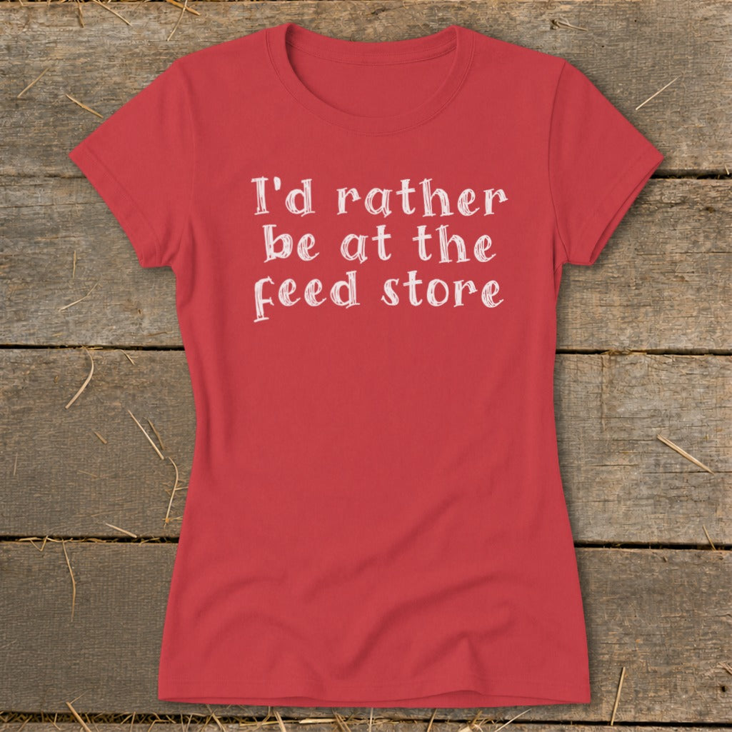 Red t-shirt with white text that says "I'd rather be at the feed store".