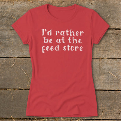 Red t-shirt with white text that says "I'd rather be at the feed store".