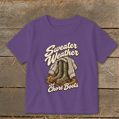 Purple t-shirt with "Sweater Weather and Chore Boots" graphic featuring boots and a sweater.