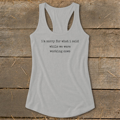 Grey tank top with text "I'm sorry for what I said while we were working cows."