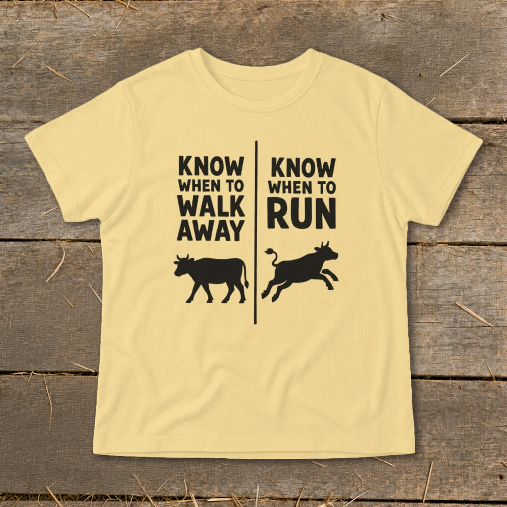 Yellow t-shirt with text "KNOW WHEN TO WALK AWAY" and a walking cow.