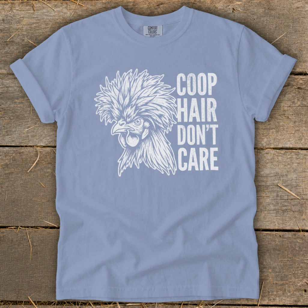 Light blue t-shirt with white graphic of a crested chicken and text "COOP HAIR DON'T CARE".
