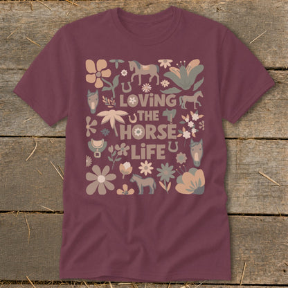 Maroon t-shirt with "Loving The Horse Life" text and horse-themed floral illustrations.