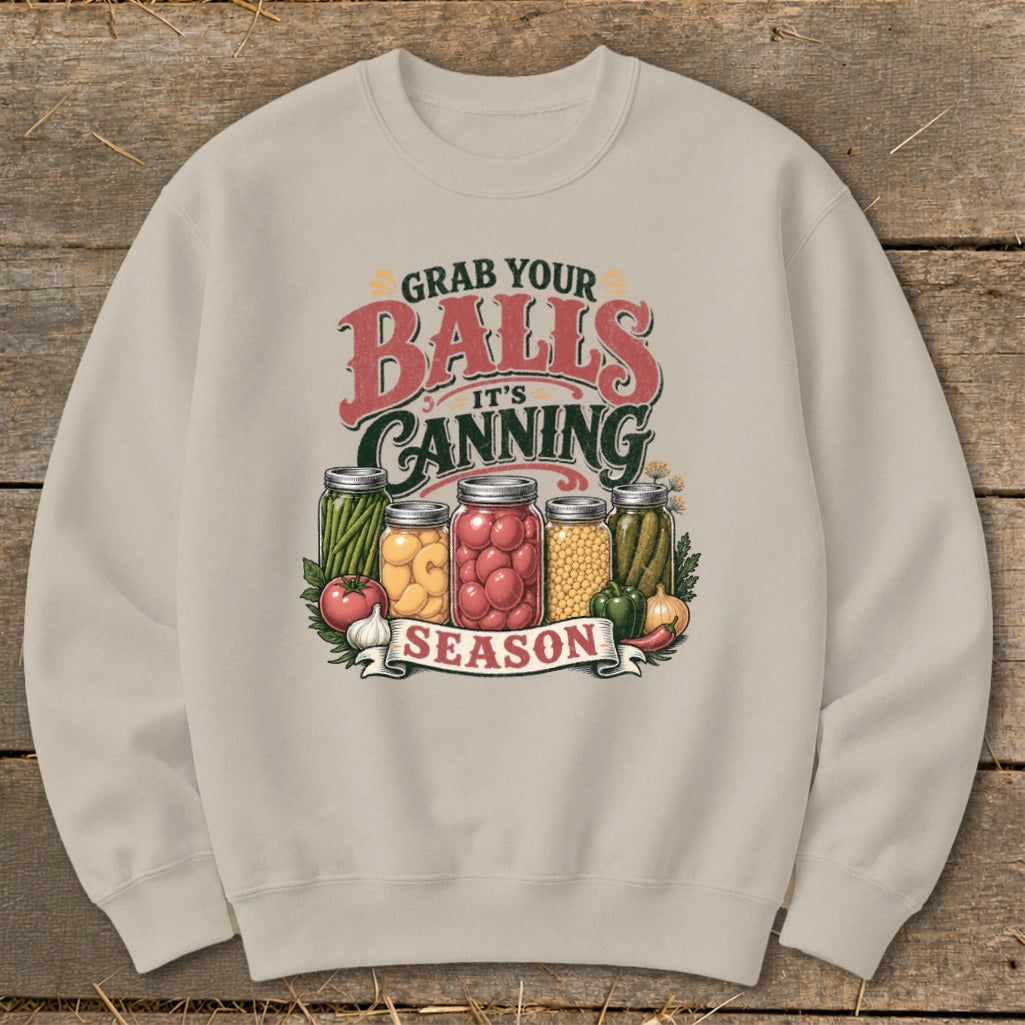 Graphic on sweatshirt with jars of preserves and "Grab your Balls It's Canning Season."