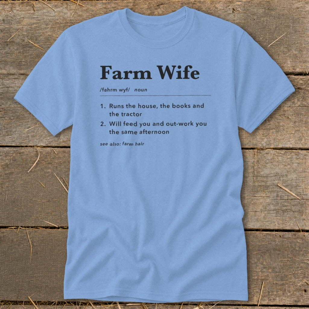 Light blue t-shirt with "Farm Wife" definition including responsibilities and "farm hair" cross-reference.