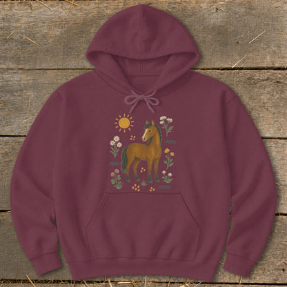 Burgundy hoodie with a brown horse, sun, and floral illustration on the chest.