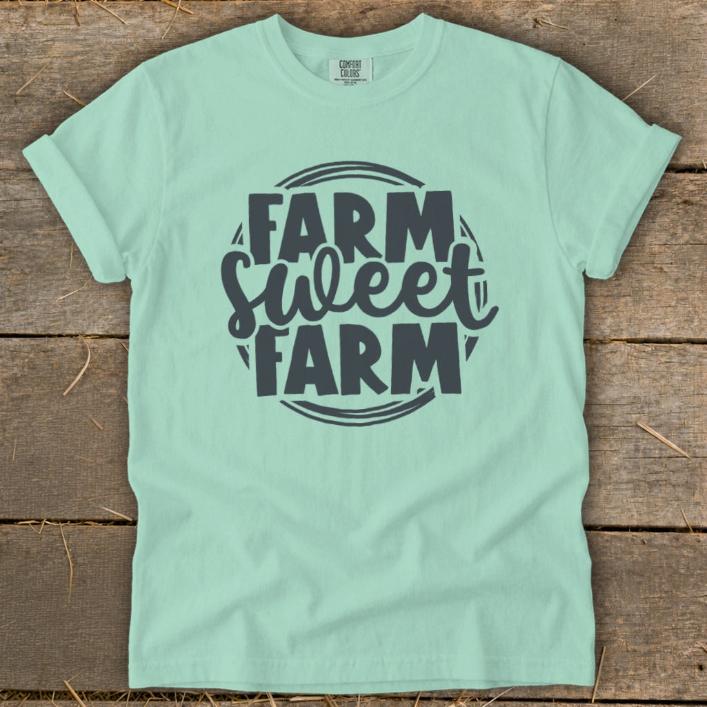 Light mint green t-shirt with "Farm Sweet Farm" graphic in dark gray.