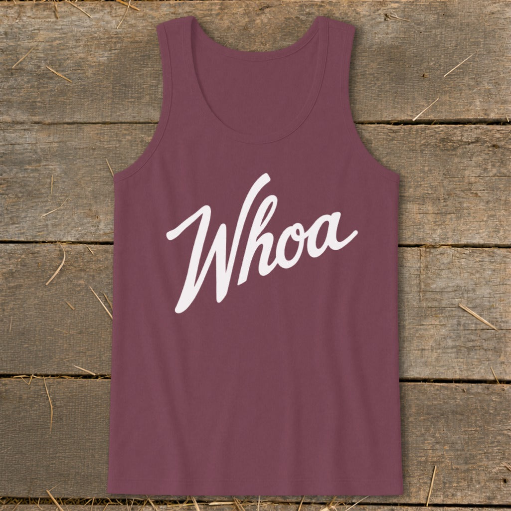 Maroon tank top with white "Whoa" graphic on rustic wood background.
