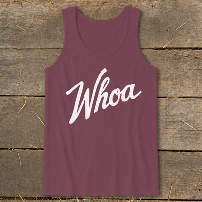 Maroon tank top with white "Whoa" graphic on rustic wood background.
