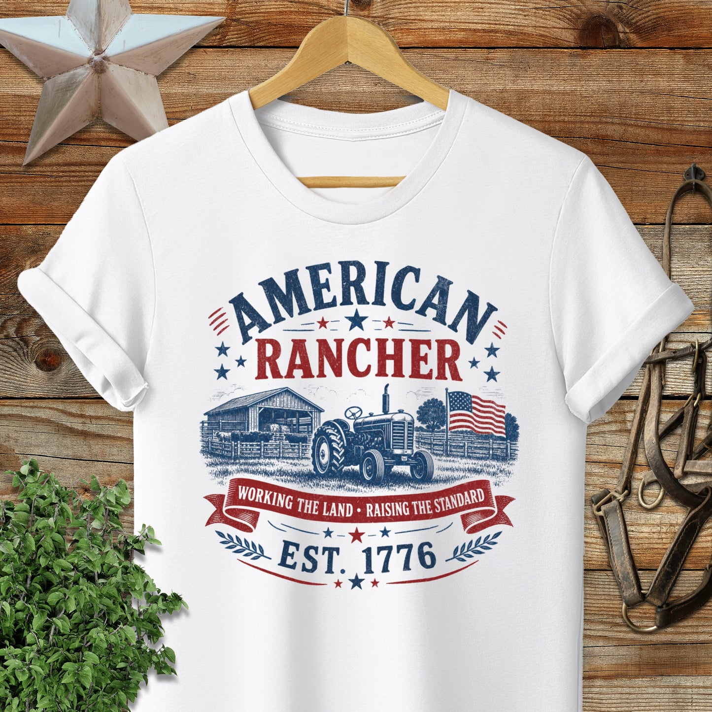 White t-shirt with "American Rancher" and "Est. 1776" text and farm graphic.
