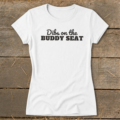 White t-shirt with black text reading "Dibs on the BUDDY SEAT".