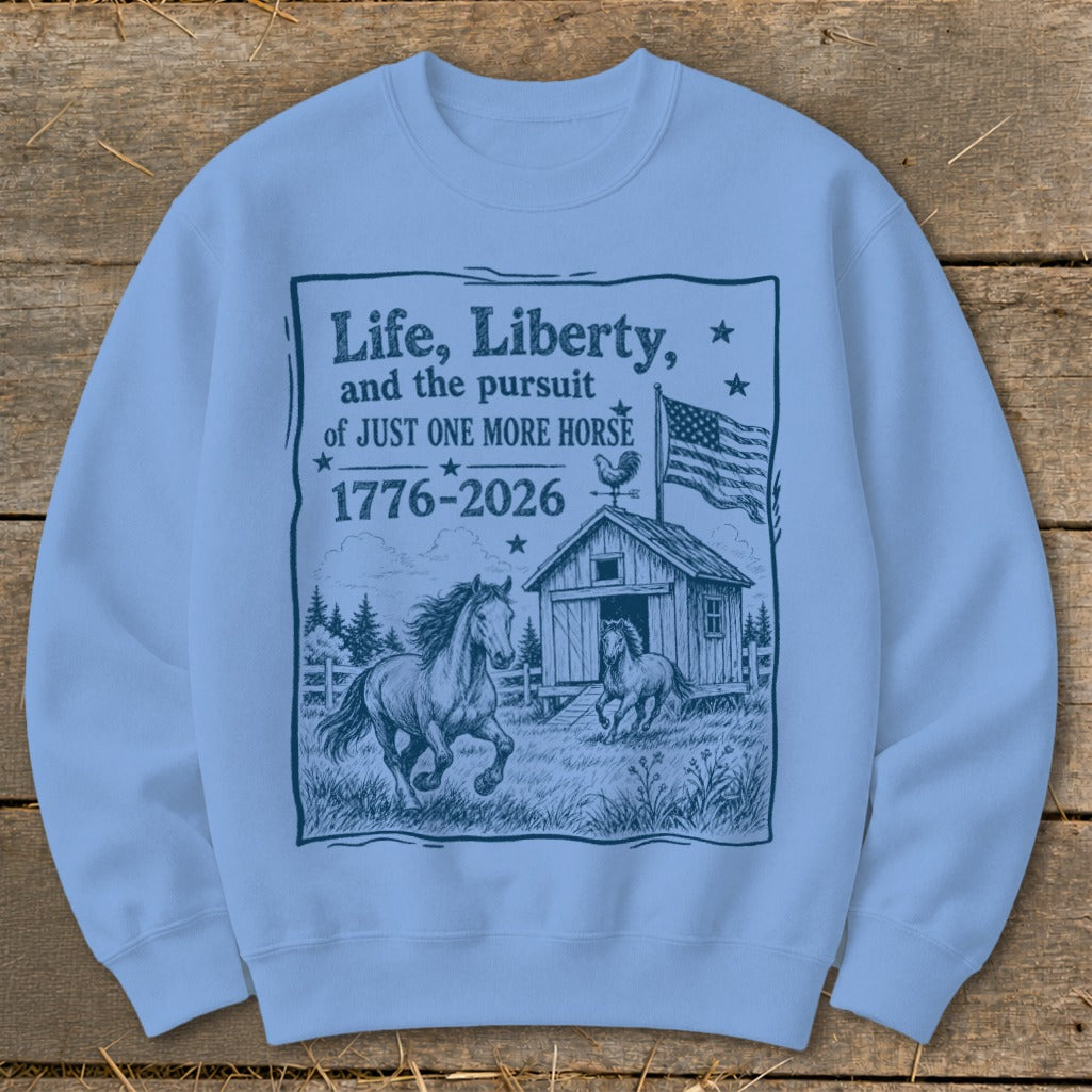 Sweatshirt with "Life, Liberty, and the pursuit of JUST ONE MORE HORSE 1776-2026" graphic.