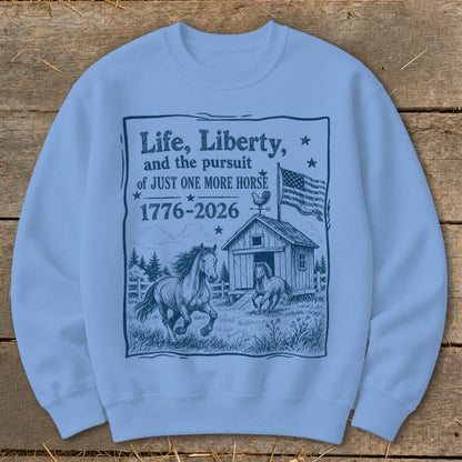 Sweatshirt with "Life, Liberty, and the pursuit of JUST ONE MORE HORSE 1776-2026" graphic.