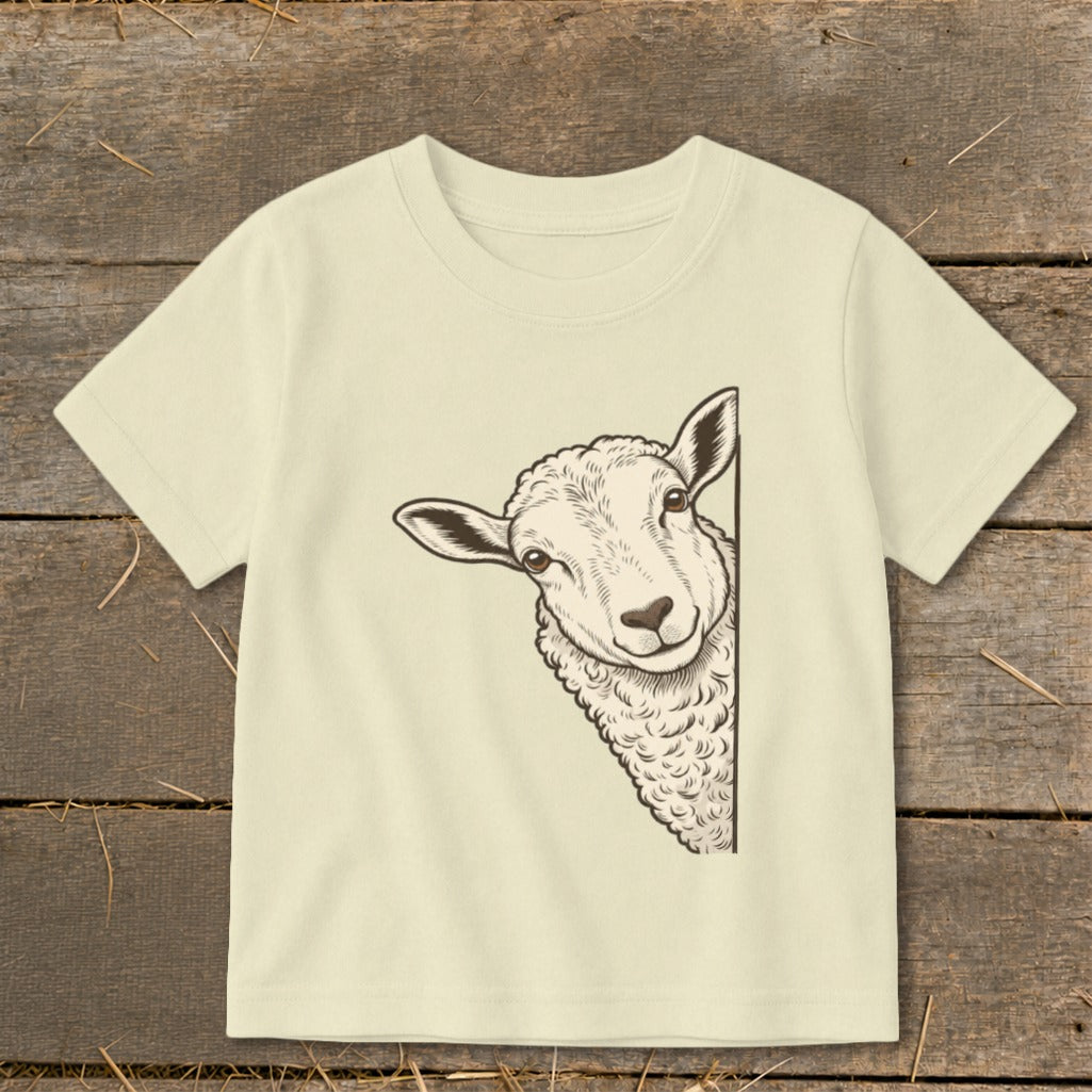 T-shirt with drawing of a sheep peeking around the side.