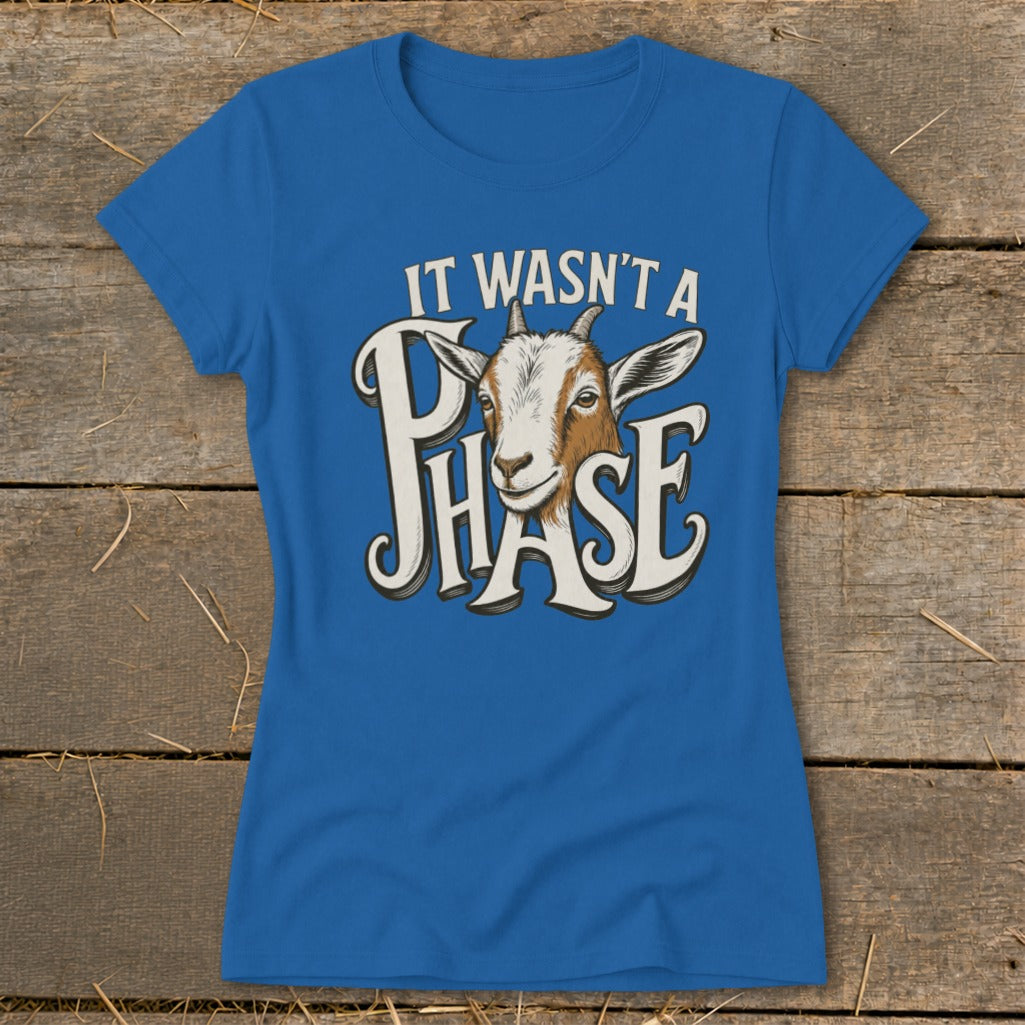 Blue t-shirt with a goat graphic and text "IT WASN'T A PHASE".