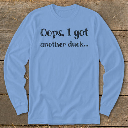 Light blue long sleeve shirt with black text "Oops, I got another duck...".