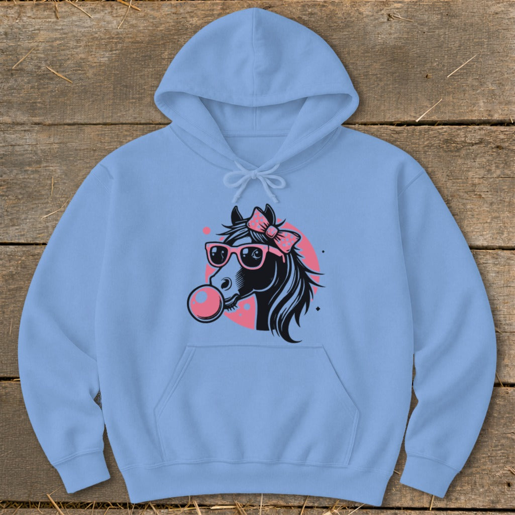 Light blue hoodie with a black horse graphic wearing pink sunglasses and blowing a bubble.