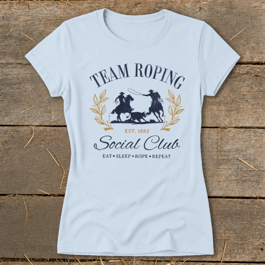 Team Roping Social Club t-shirt with "Eat, Sleep, Rope, Repeat" text.