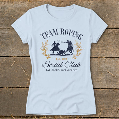 Team Roping Social Club t-shirt with "Eat, Sleep, Rope, Repeat" text.