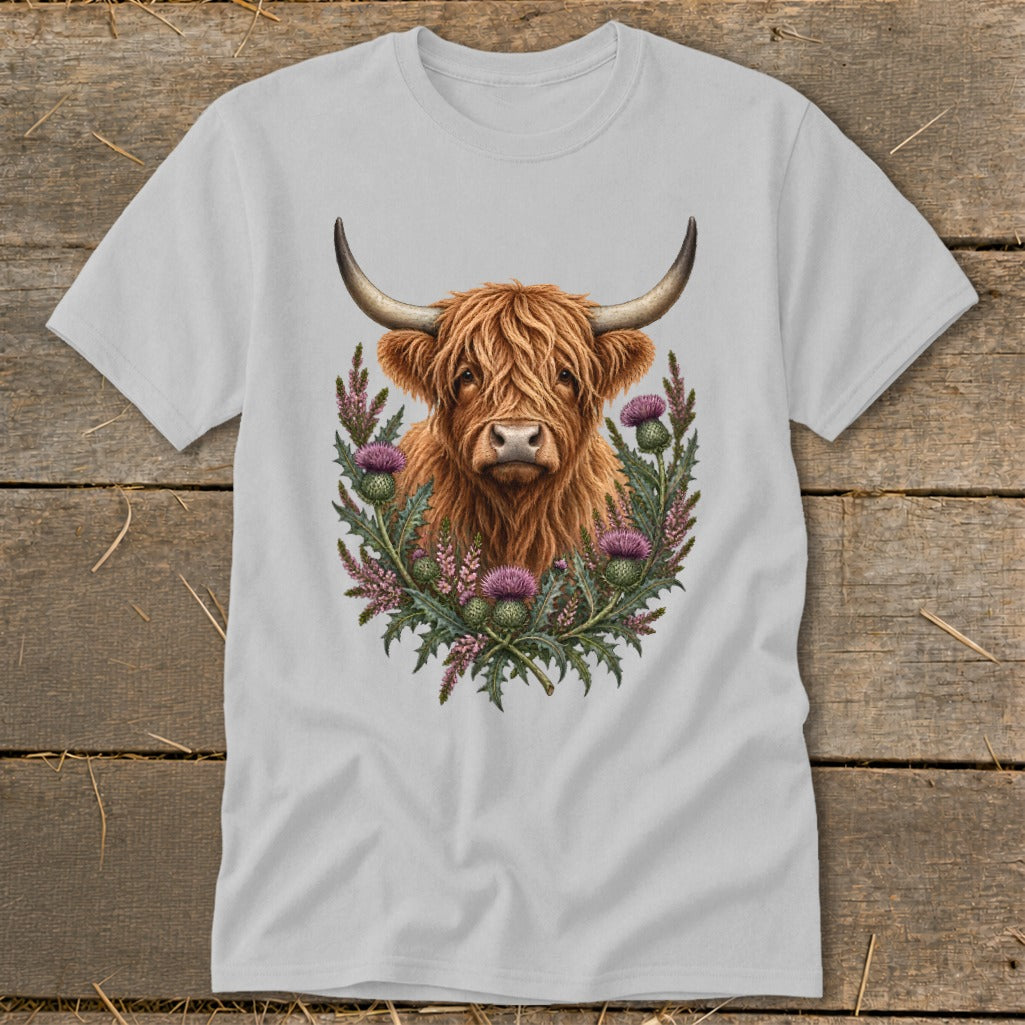 Highland cow with thistles and foliage design on a grey t-shirt.