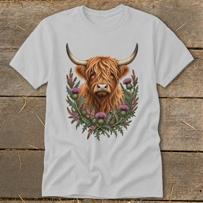 Highland cow with thistles and foliage design on a grey t-shirt.