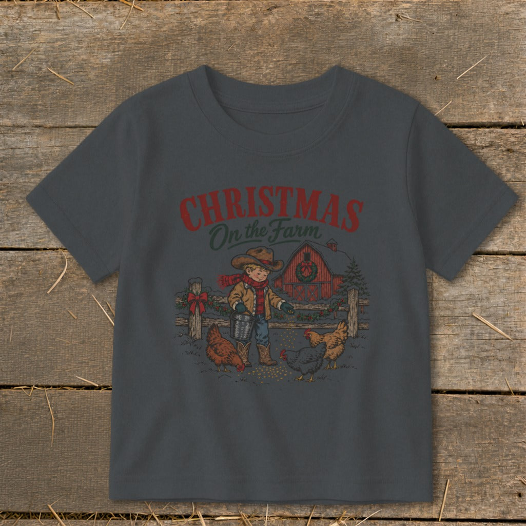 Boy feeding chickens in front of a barn with text "Christmas On the Farm".
