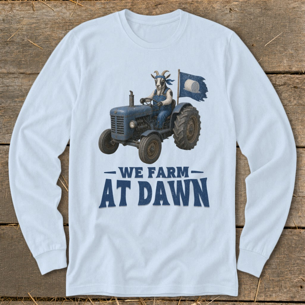 Light blue long-sleeve shirt with goat driving a blue tractor, "WE FARM AT DAWN" text.