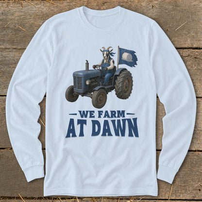 Light blue long-sleeve shirt with goat driving a blue tractor, "WE FARM AT DAWN" text.