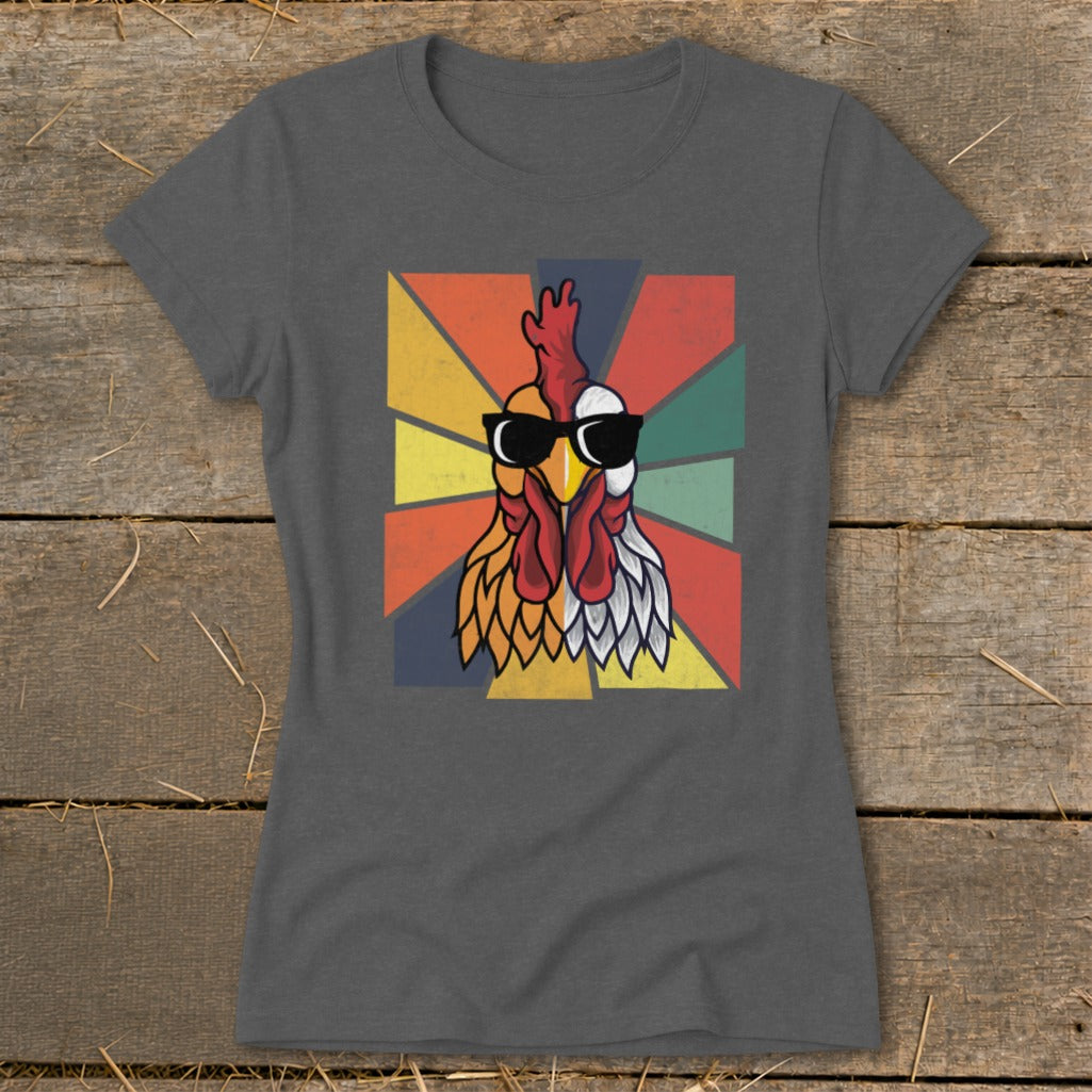 Cool rooster with sunglasses on dark grey t-shirt with colorful geometric background.