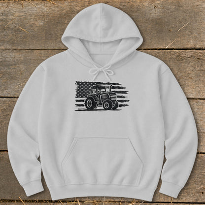 White hoodie with a distressed American flag and tractor graphic.