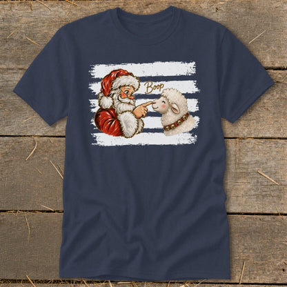 Santa booping a sheep's nose on a navy t-shirt with white stripes.