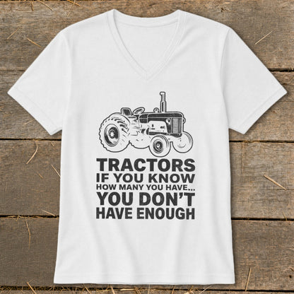 White t-shirt with tractor graphic and text: "Tractors if you know how many you have... you don't have enough."