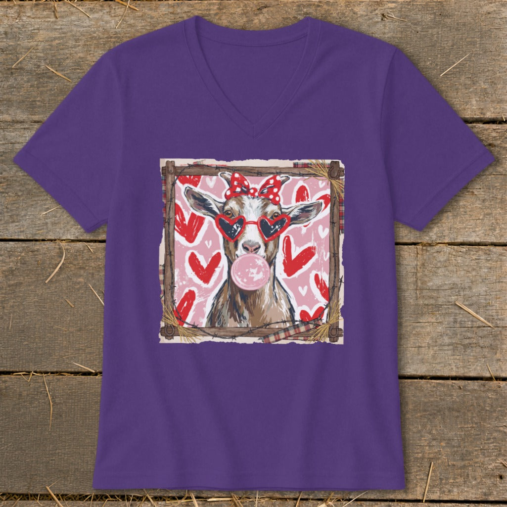 Goat wearing heart sunglasses and a bow blows bubblegum, framed by hearts.