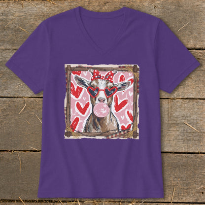 Goat wearing heart sunglasses and a bow blows bubblegum, framed by hearts.