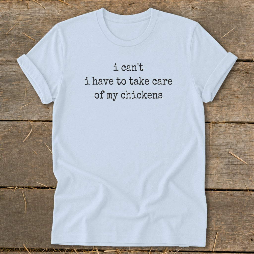 Light blue t-shirt with black text "i can't i have to take care of my chickens".