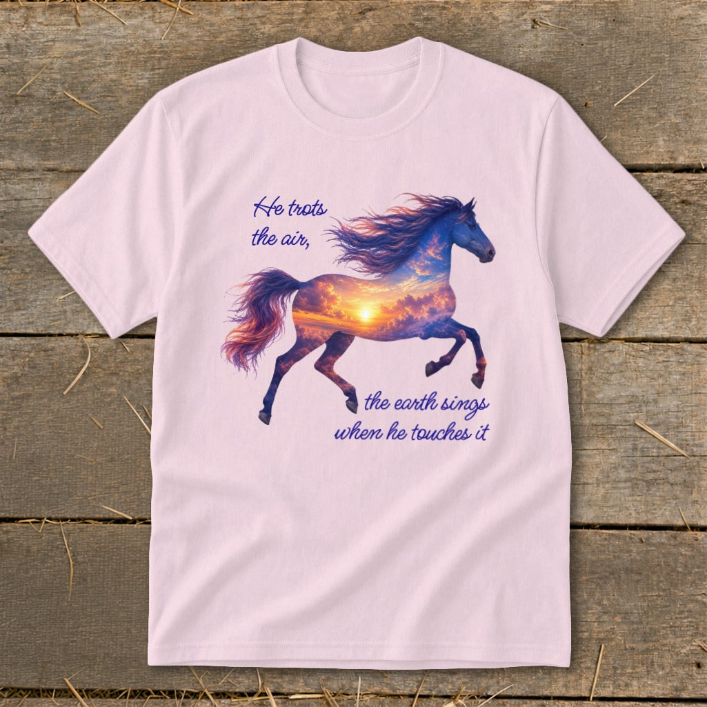 A light pink t-shirt featuring a running horse graphic filled with a sunset sky and text.
