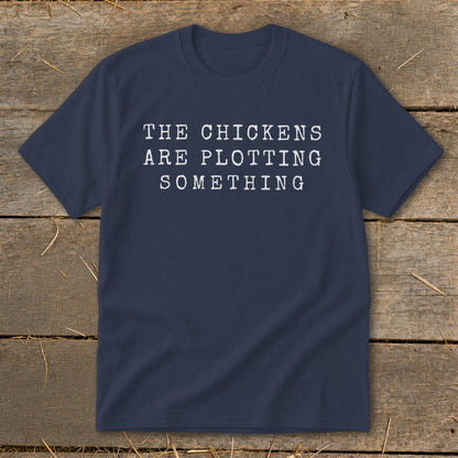 Navy t-shirt with white text "THE CHICKENS ARE PLOTTING SOMETHING".