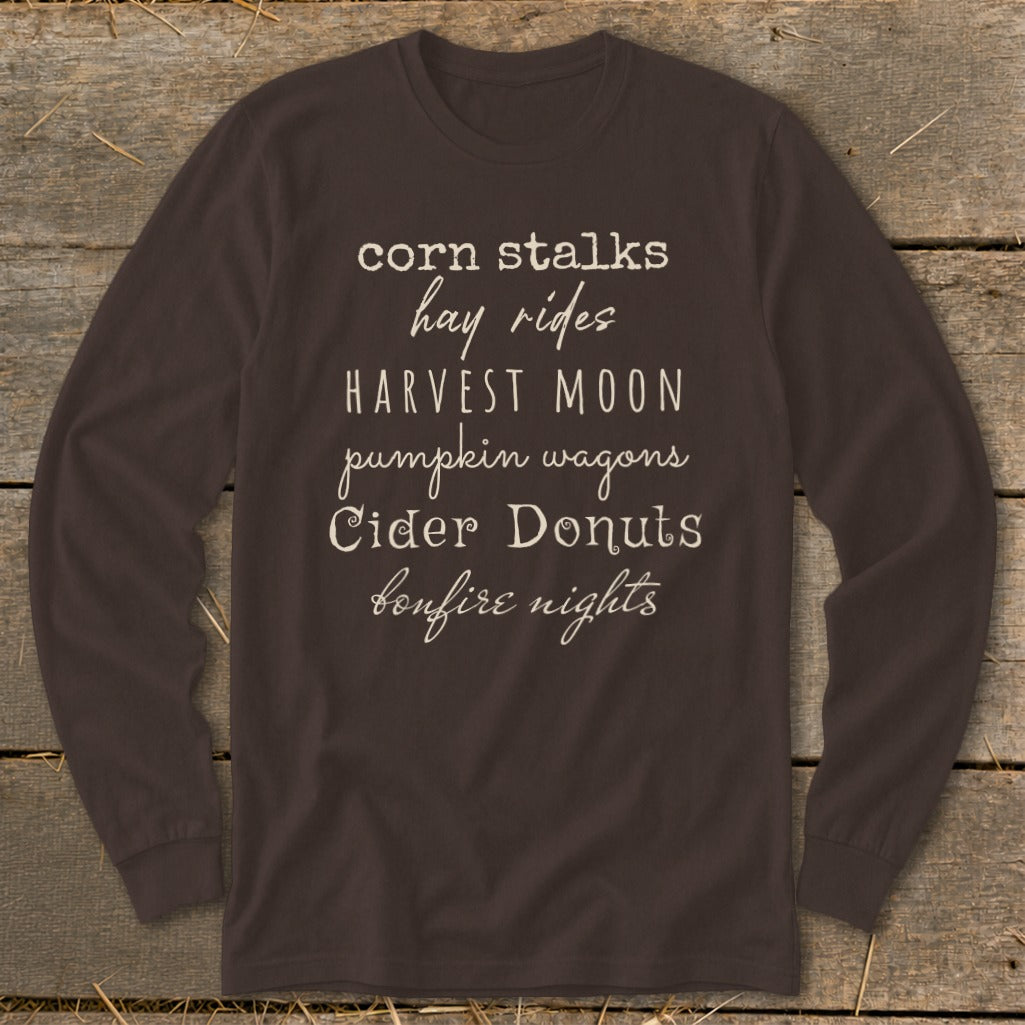 Brown long-sleeve shirt with white text listing fall activities.