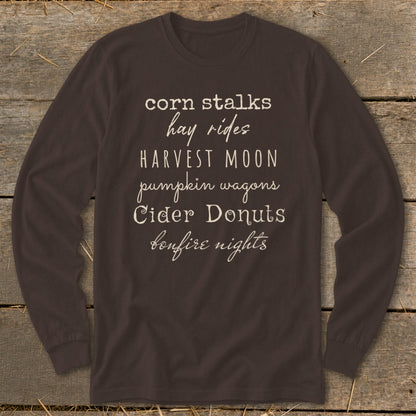 Brown long-sleeve shirt with white text listing fall activities.