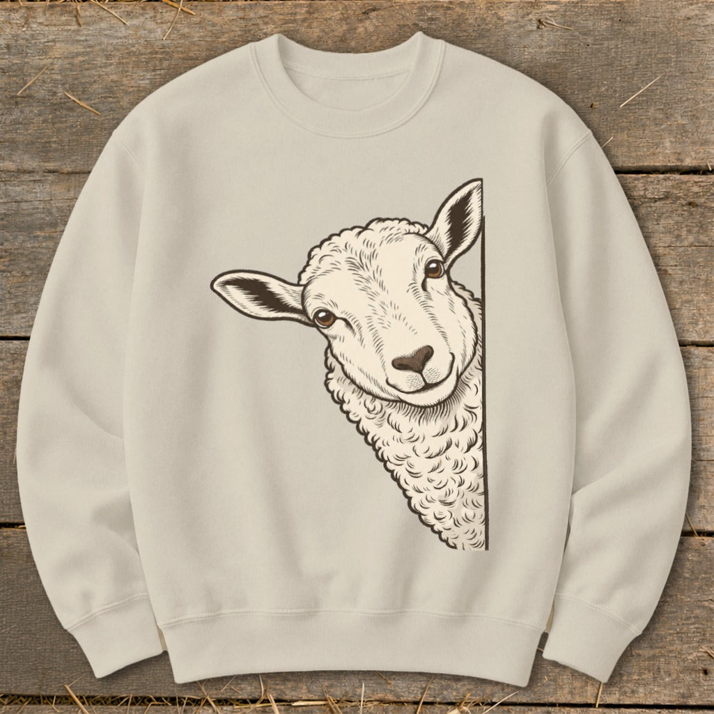 Cream sweatshirt with a peeking sheep illustration on the front.
