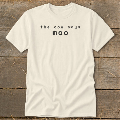 Cream t-shirt with "the cow says moo" printed in black text.