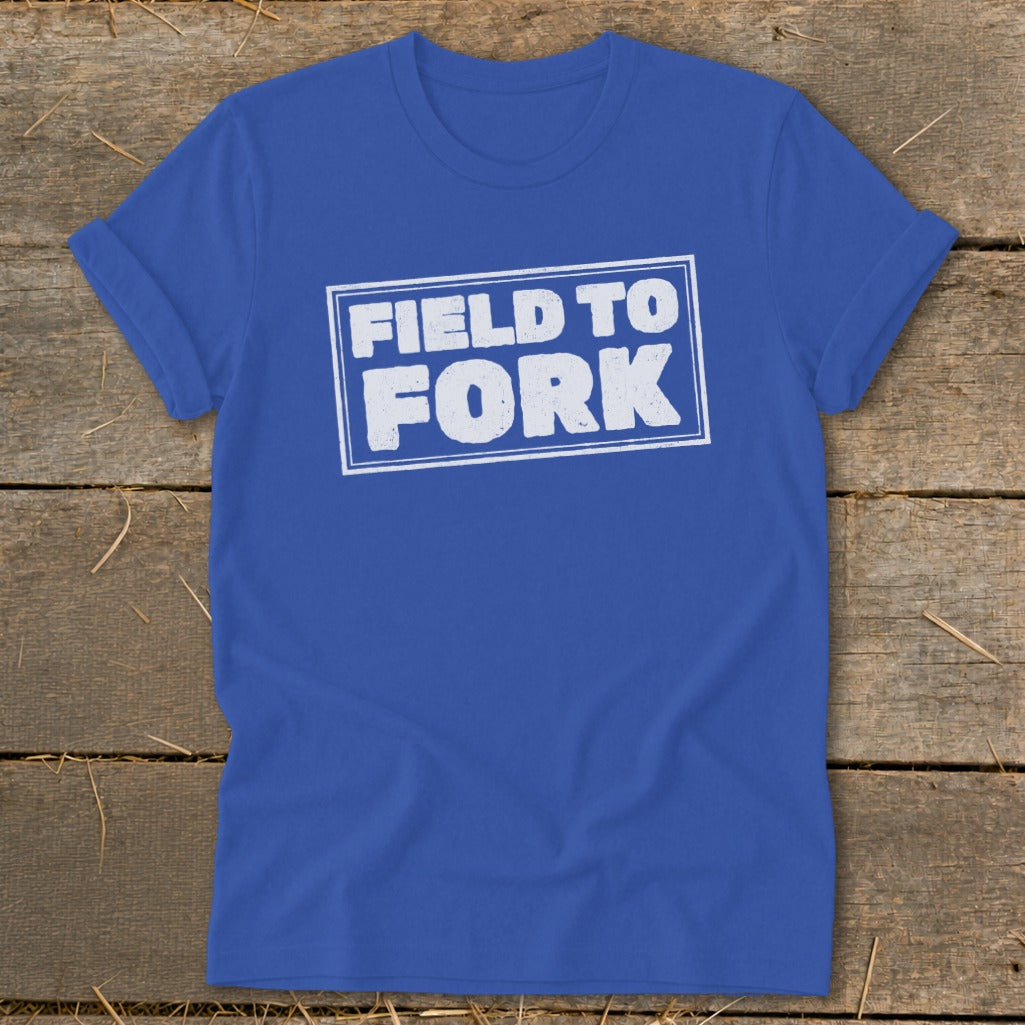 Royal blue t-shirt featuring a white distressed graphic with the text FIELD TO FORK.
