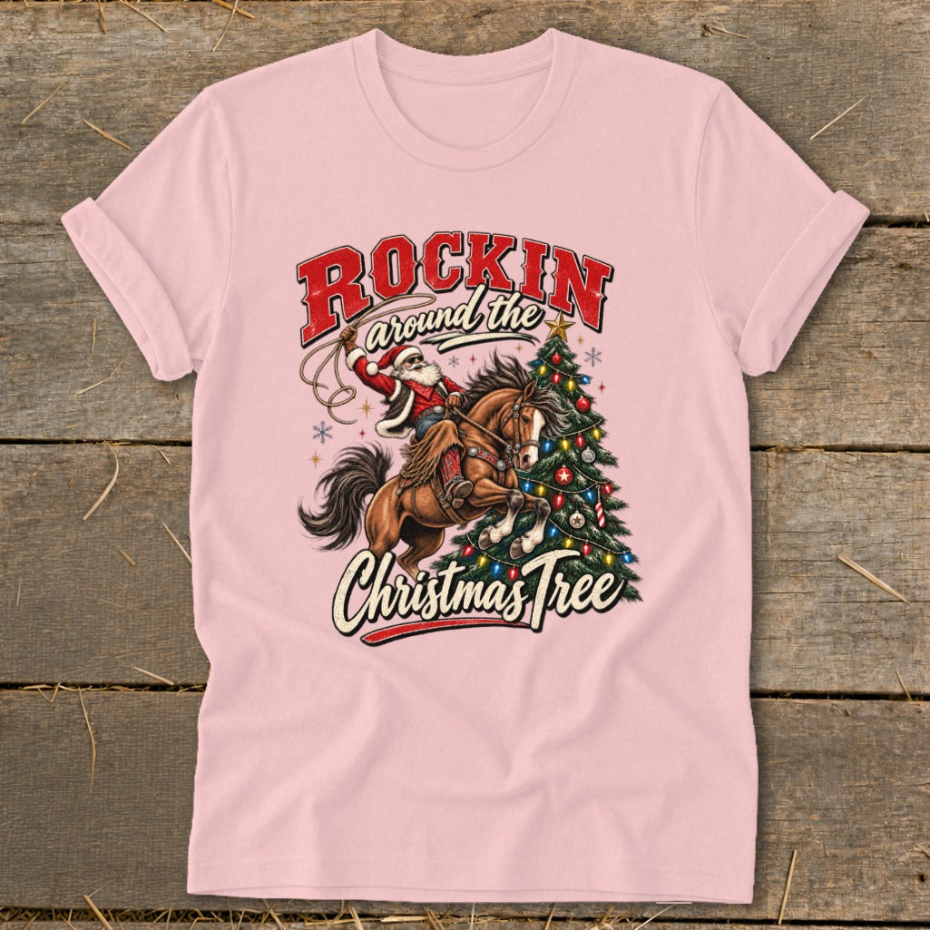 Santa riding a horse, swinging a lasso around a Christmas tree, text "Rockin' Around the Christmas Tree".