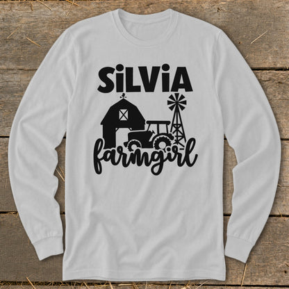 White long-sleeve shirt with "SILVIA farmingirl" and farm graphics.