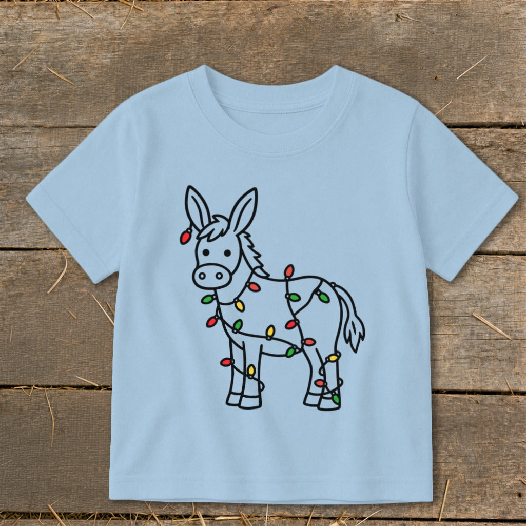 Light blue t-shirt with a cartoon donkey wrapped in colorful Christmas lights.