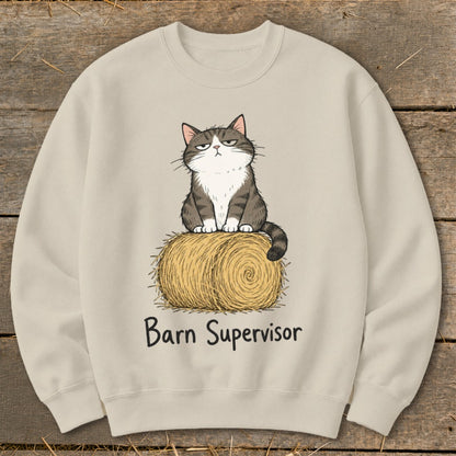 Cat sitting on hay bale with text "Barn Supervisor" printed below.