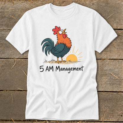 White t-shirt with a cartoon rooster crowing at sunrise and text "5 AM Management."