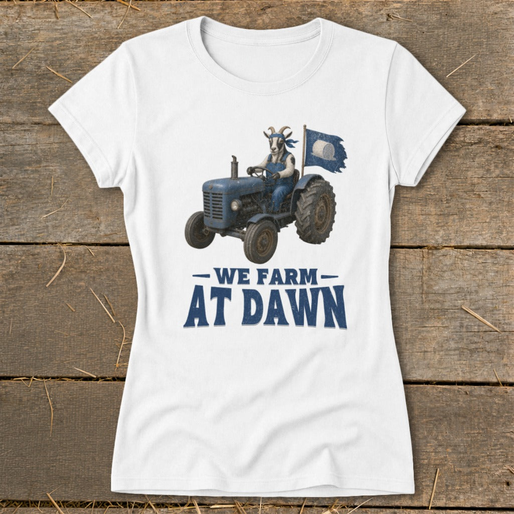 Goat in overalls driving a tractor with a flag, text "We Farm At Dawn".